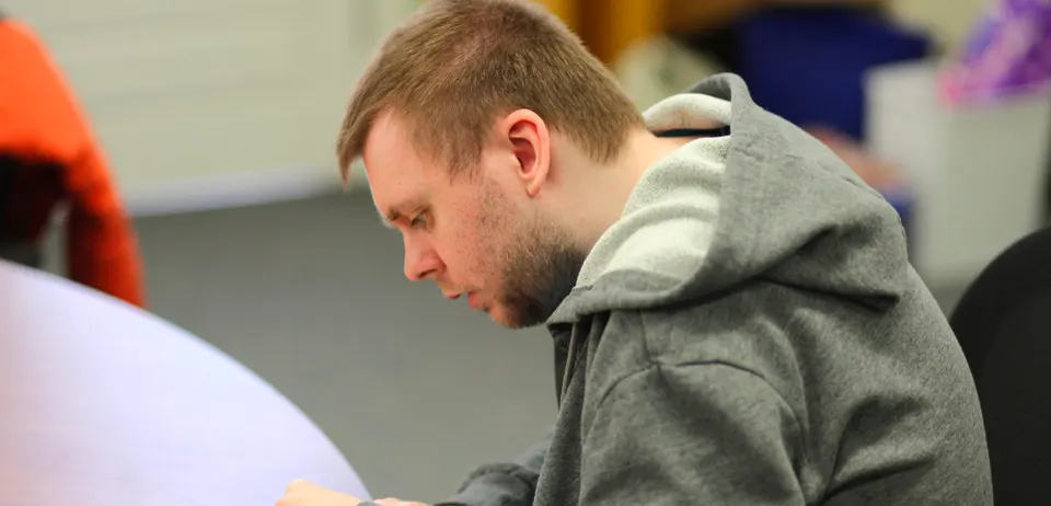 Noah enjoying a creative hobby
